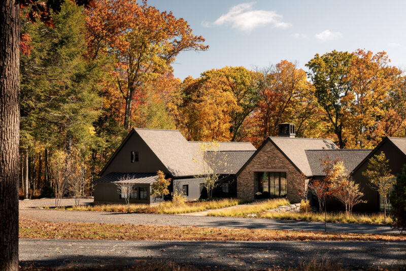 Exterior architecture of a modern home with black wood siding located in the Poconos.