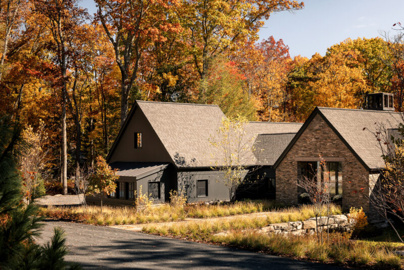 Exterior architecture of a modern home with black wood siding located in the Poconos.