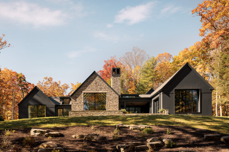 Exterior architecture of a modern home with black wood siding located in the Poconos.