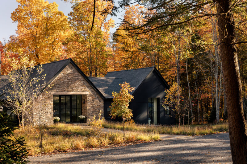 Exterior architecture of a modern home with black wood siding located in the Poconos.