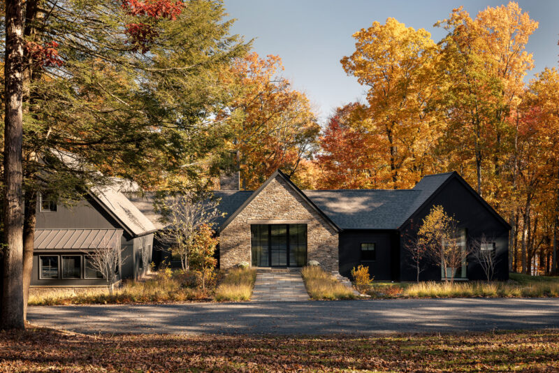 Exterior architecture of a modern home with black wood siding located in the Poconos.