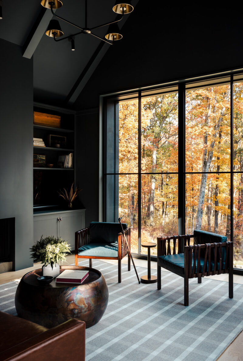 Interior design of a modern office with fall leaves outside located in the Poconos.