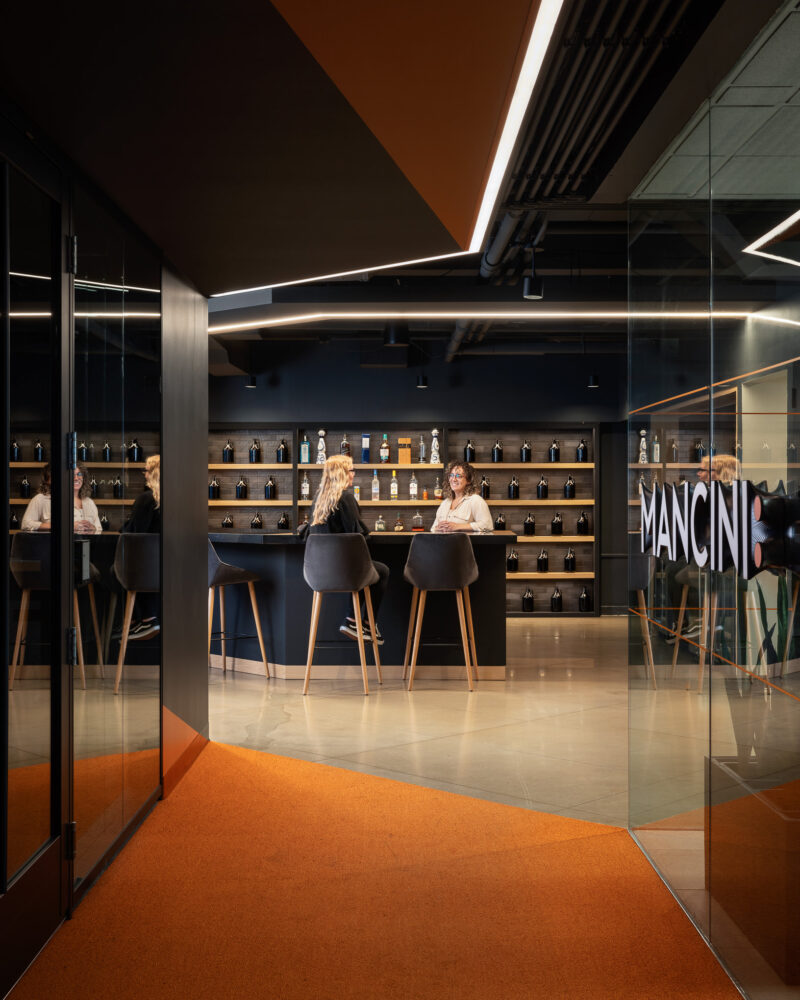 Interior design of a corporate office highlighting a bar and lounge in New York City.