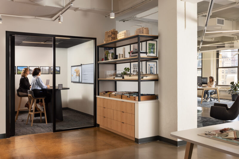 Interior design of a corporate office with an open workspace in New York City.