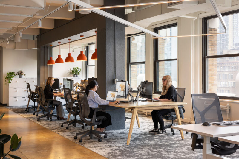 Interior design of a corporate office with an open workspace in New York City.