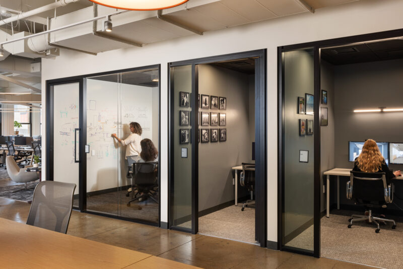 Interior design of a corporate office with a large white board in New York City.