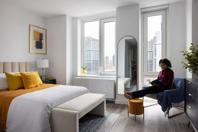 Architecture highlighting the apartment bedroom at the The Motto High-Rise, Bronx NY