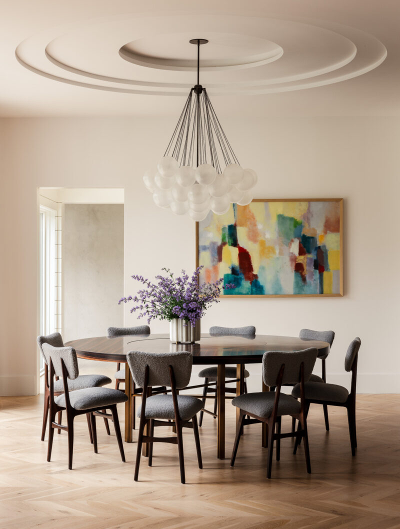 Interior design of a Rumson NJ home featuring a large pendent light and beautiful art