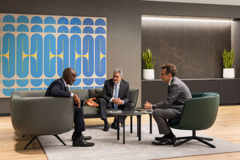 Lifestyle photograph of a team of people having a meeting
