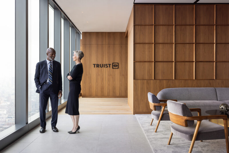 Lifestyle photograph of a man and woman in a reception area