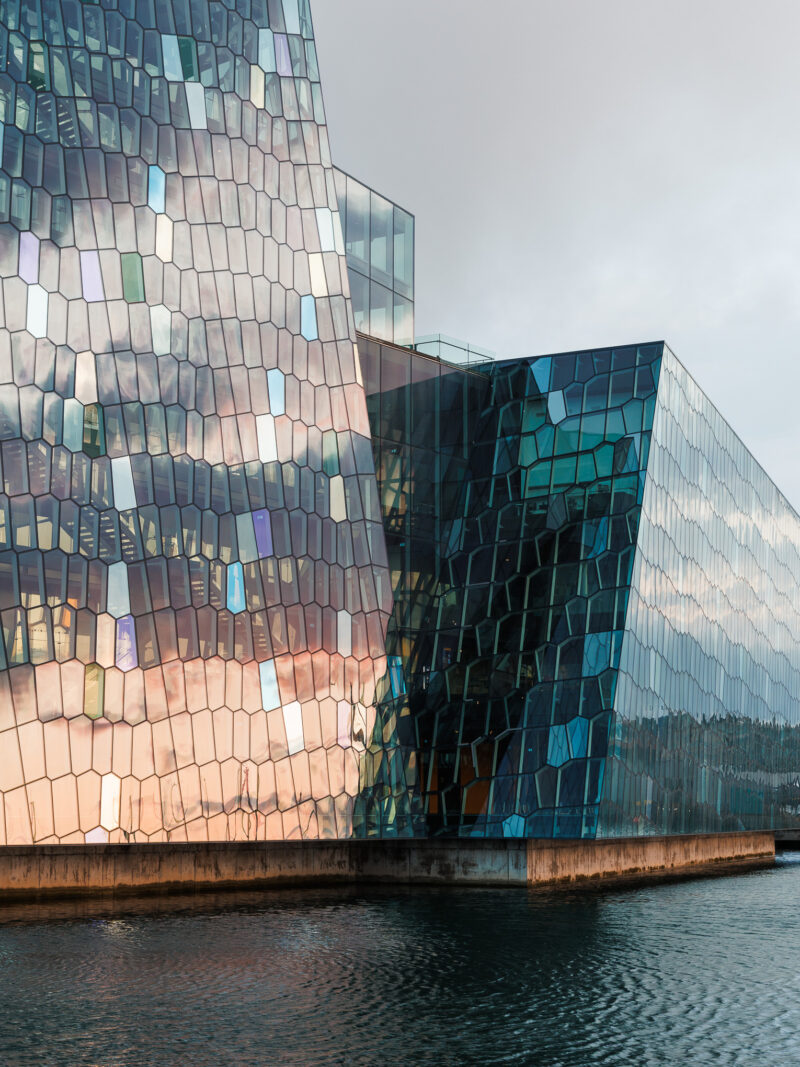 Exterior architecture of the Harpa Concert Hall, in Reykjavík,Iceland during sunset. Photographed by Van Tassell Studio.