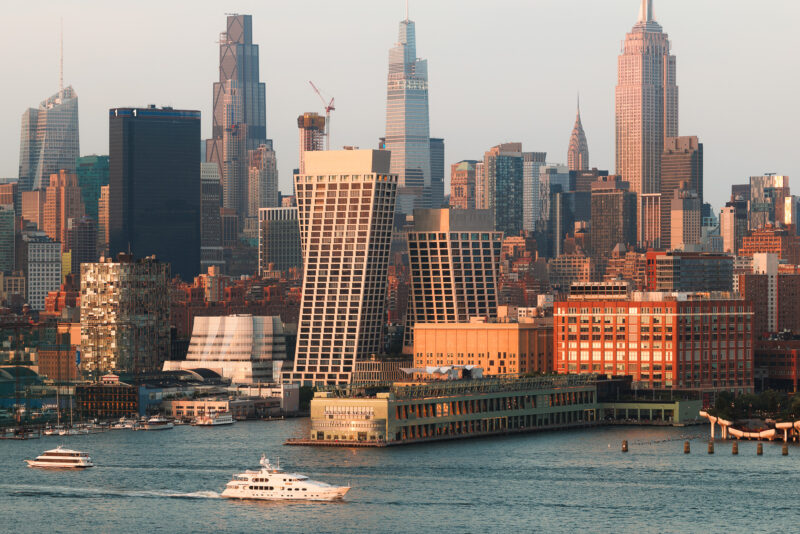 Exterior architecture of One High Line Condominium Residences taken during sunset from Hoboken.