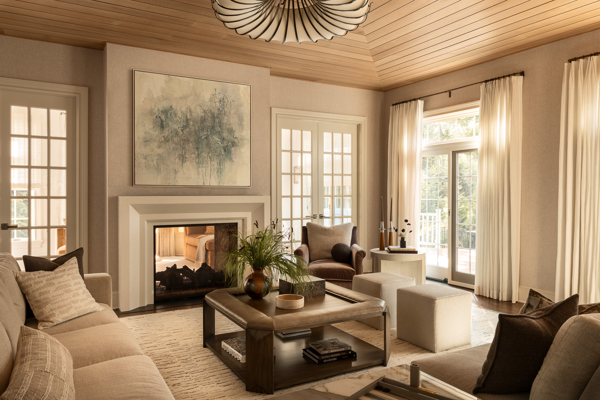 modern living room with a fireplace and large decorative artwork