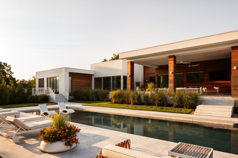Exterior architecture of a modern home looking over a pool located in Ocean New Jersey.