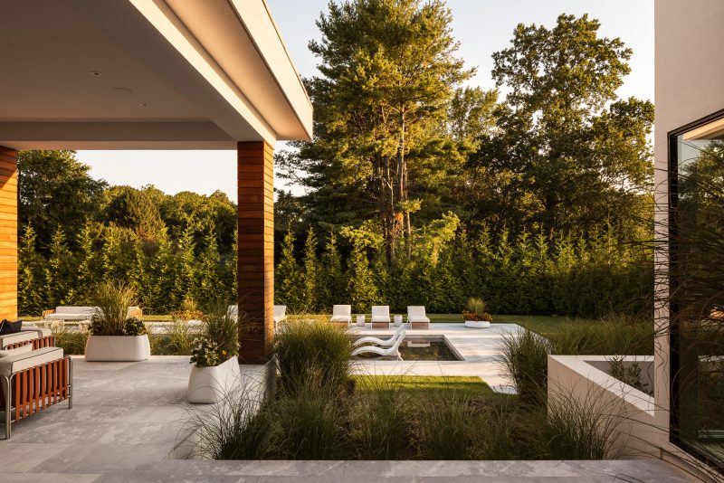 Exterior architecture of a modern home looking over a pool located in Ocean New Jersey.