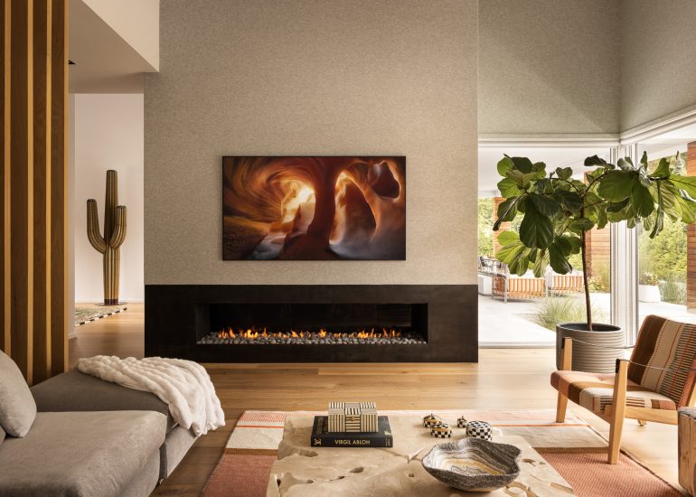 Living room design with a large fireplace in a custom home located in Ocean New Jersey.