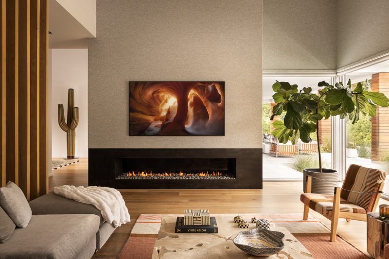 Living room design with a large fireplace in a custom home located in Ocean New Jersey.