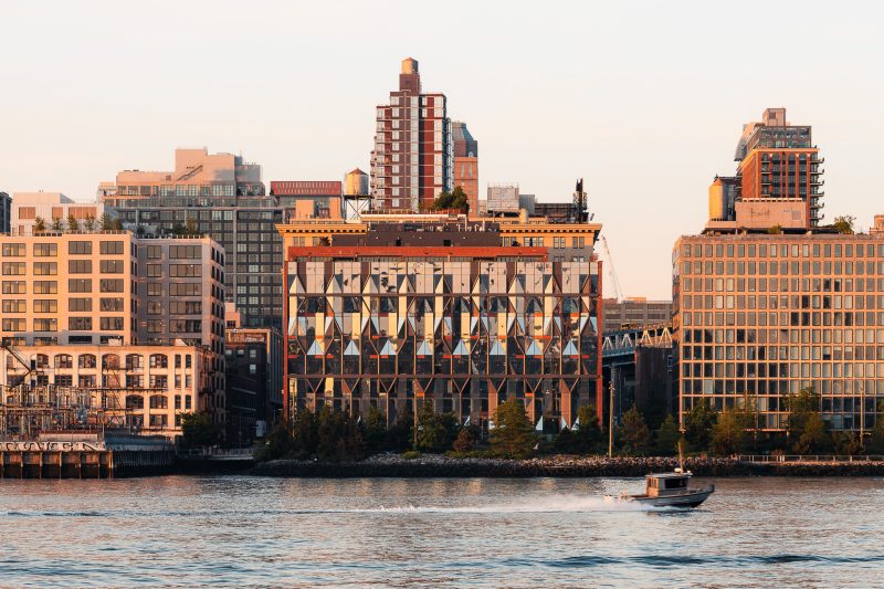 Exterior architecture of 10 Jay Street mixed use building in Dumbo Brooklyn taken during a dramatic sunrise.