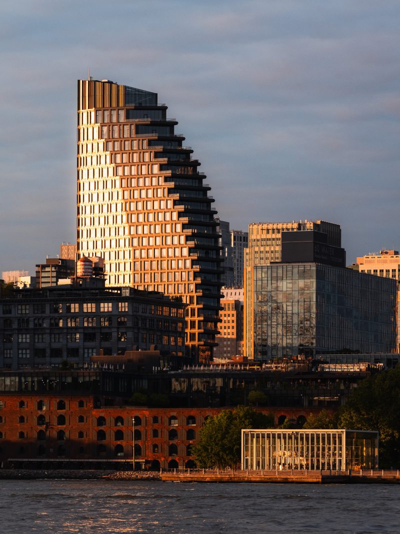 Exterior architecture of the Olympia Dumbo condominium taken during a dramatic sunrise in Brooklyn NY
