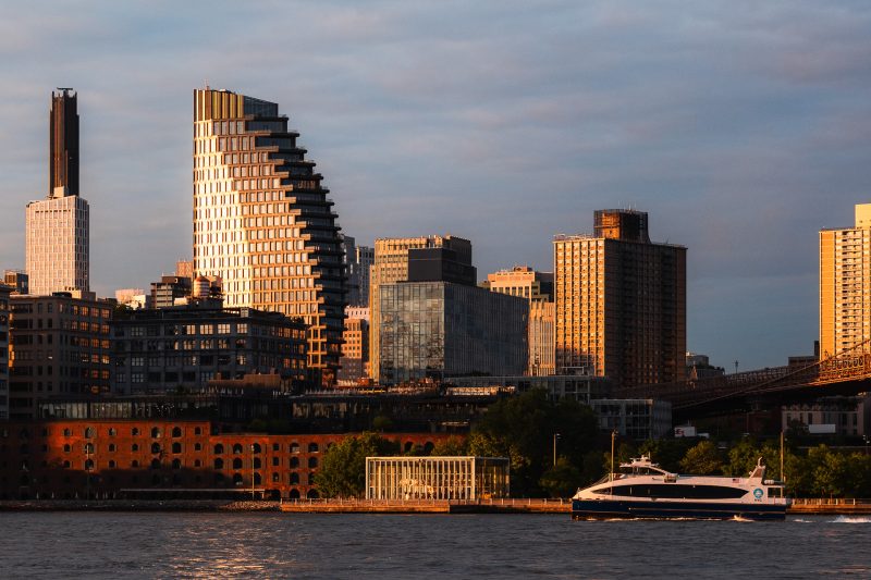 Exterior architecture of the Olympia Dumbo condominium taken during a dramatic sunrise in Brooklyn NY