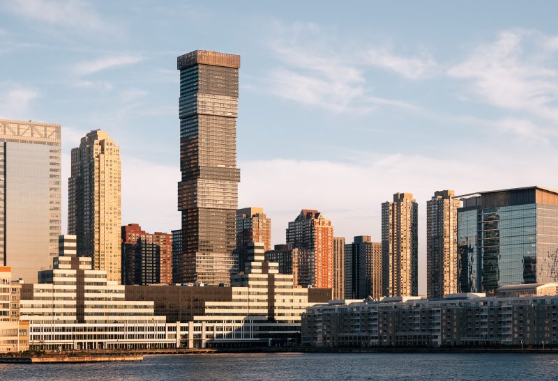 Exterior architecture of Urby Jersey City apartment building taken during a dramatic sunrise.