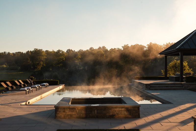 Morning mist over a residential home's pool in Leesburg, VA